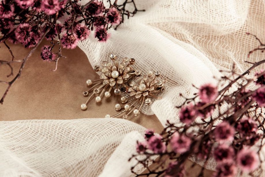 Pearl beads and glass stones on older hair clips